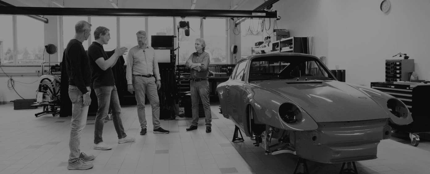 The REEN team in the workshop alongside the reengineered Porsche 993